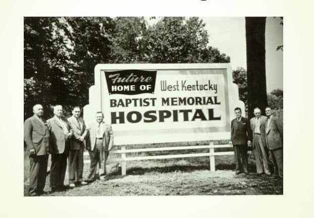 Group of people by a sign