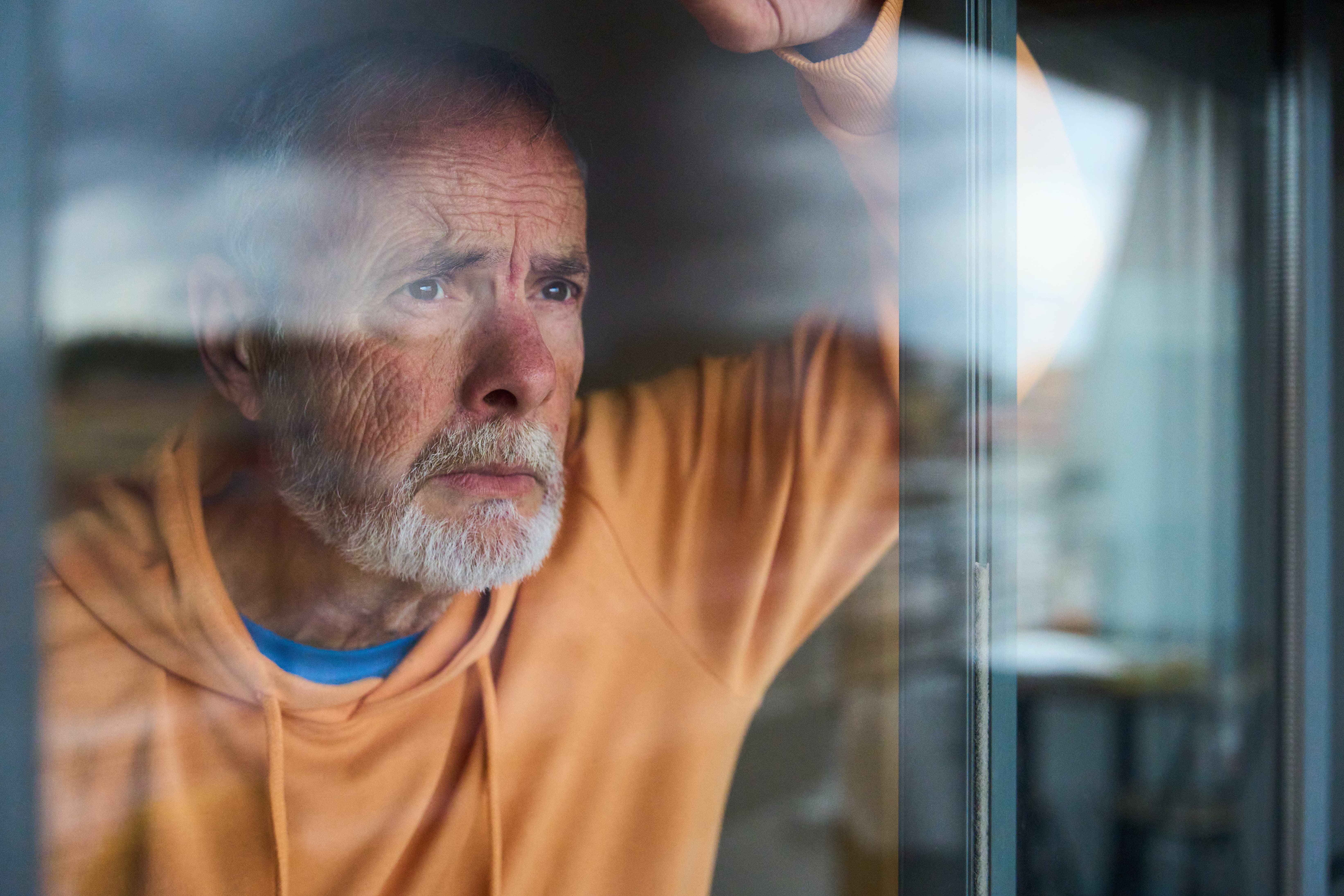 Man Staring Out a Window