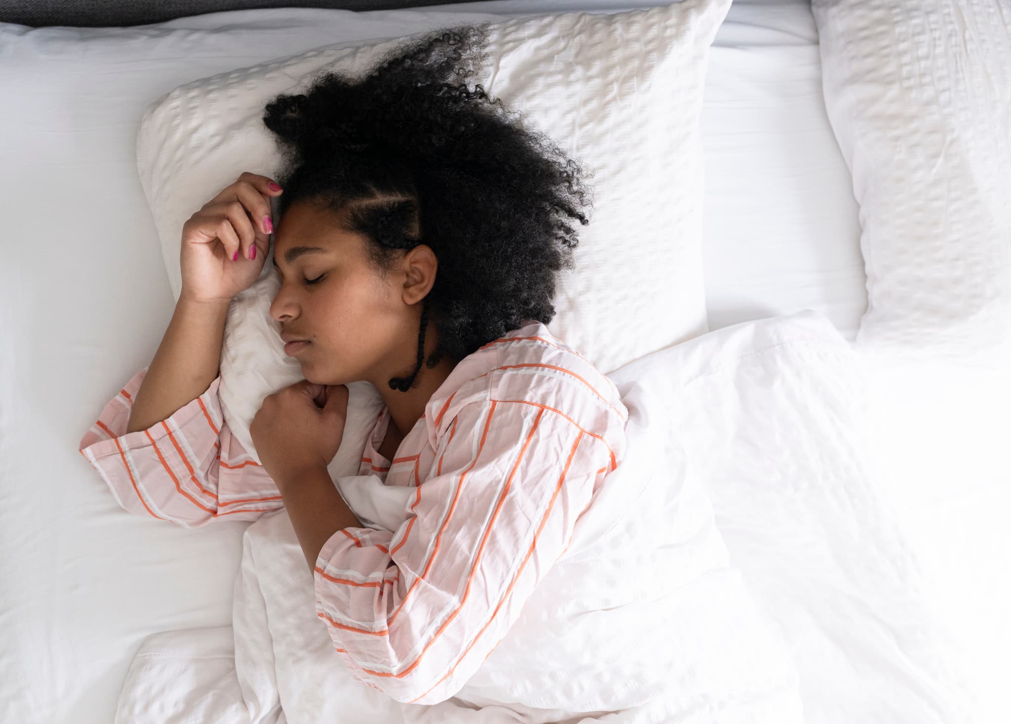 Woman Asleep in Bed