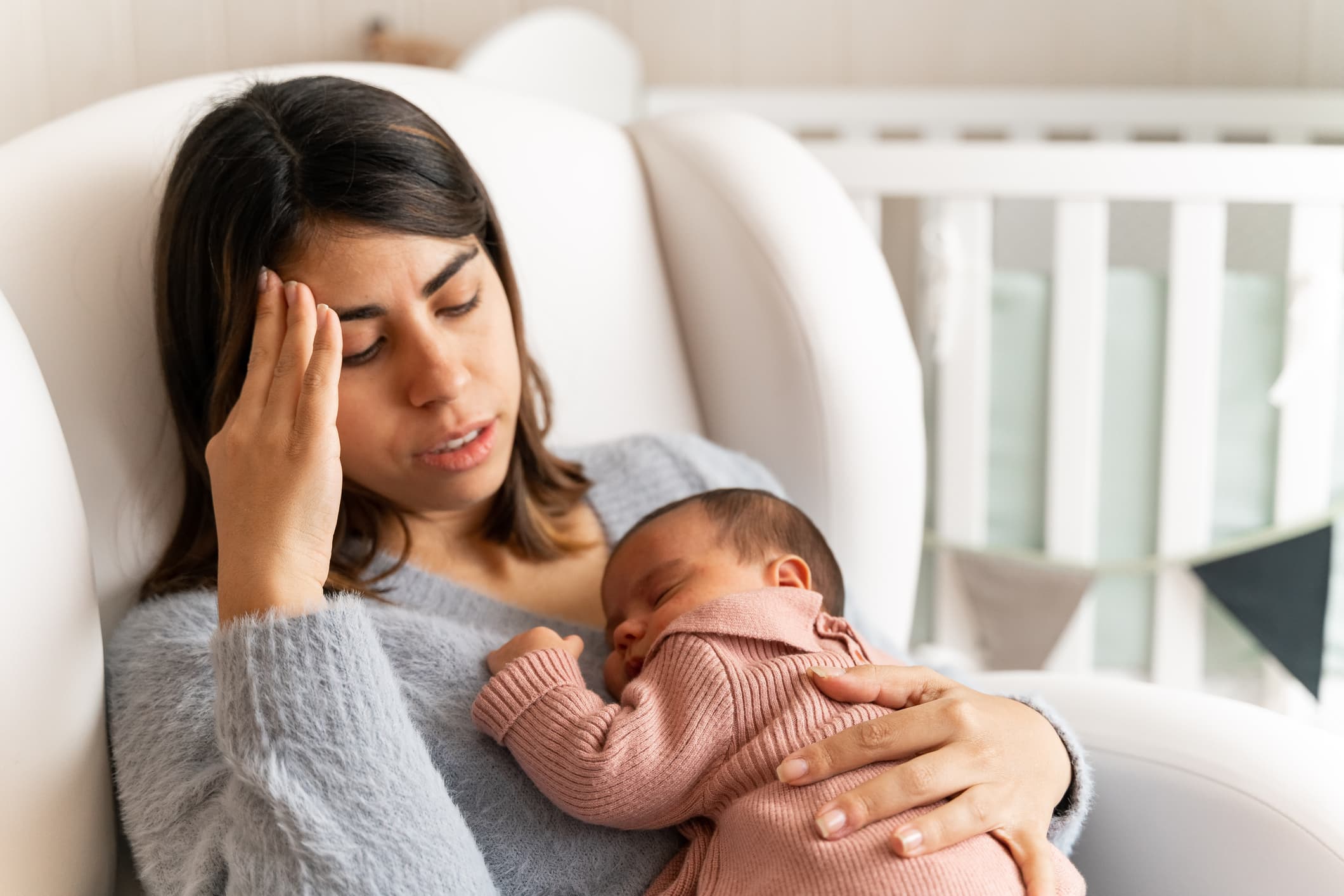 Woman Sitting in Chair with Newborn