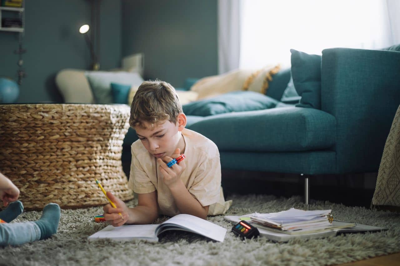 Young boy with ADHD doing homework