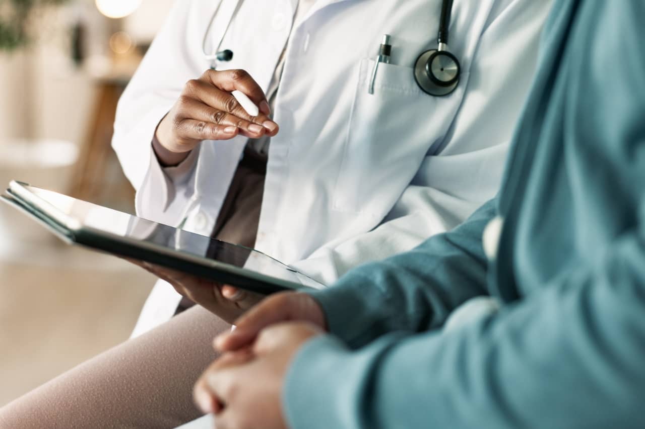 Doctor and patient speaking