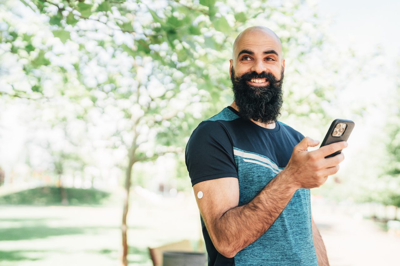 Man in nature holding a phone