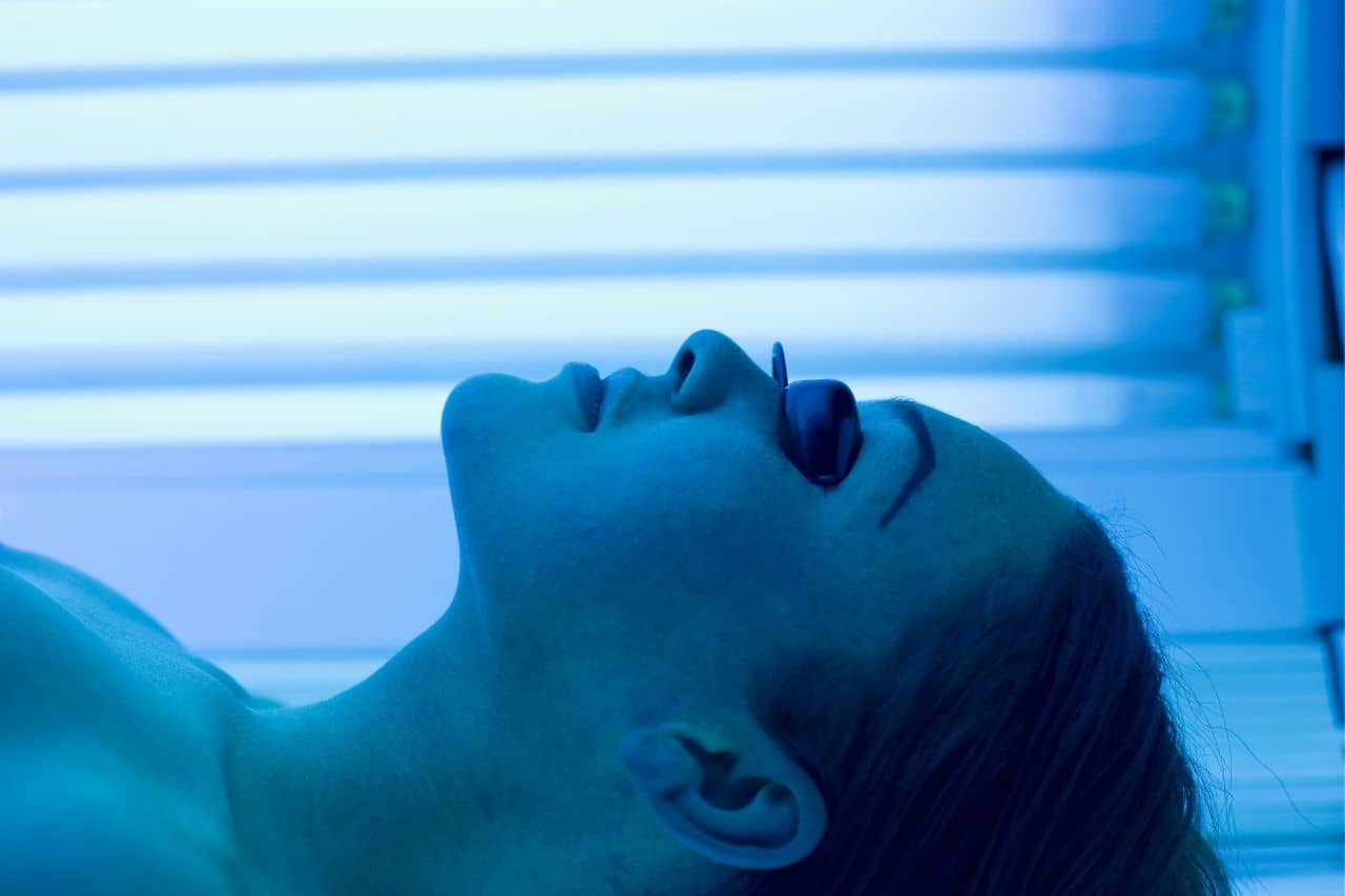 Woman in a tanning bed