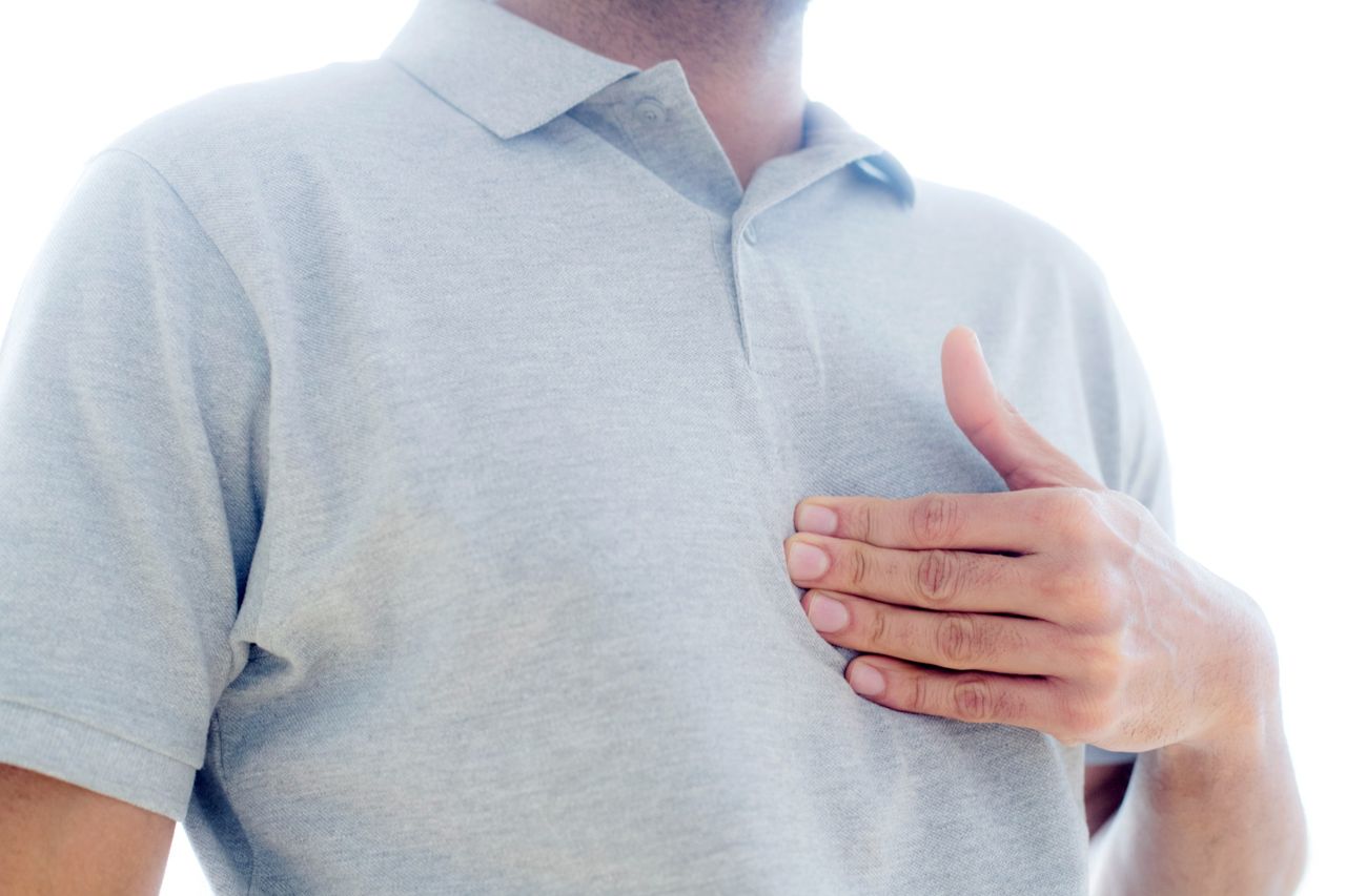 Man holding his chest