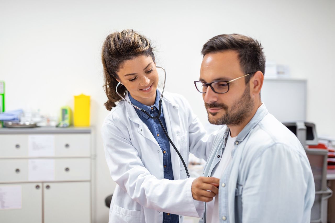 Nurse checking a patient's heart