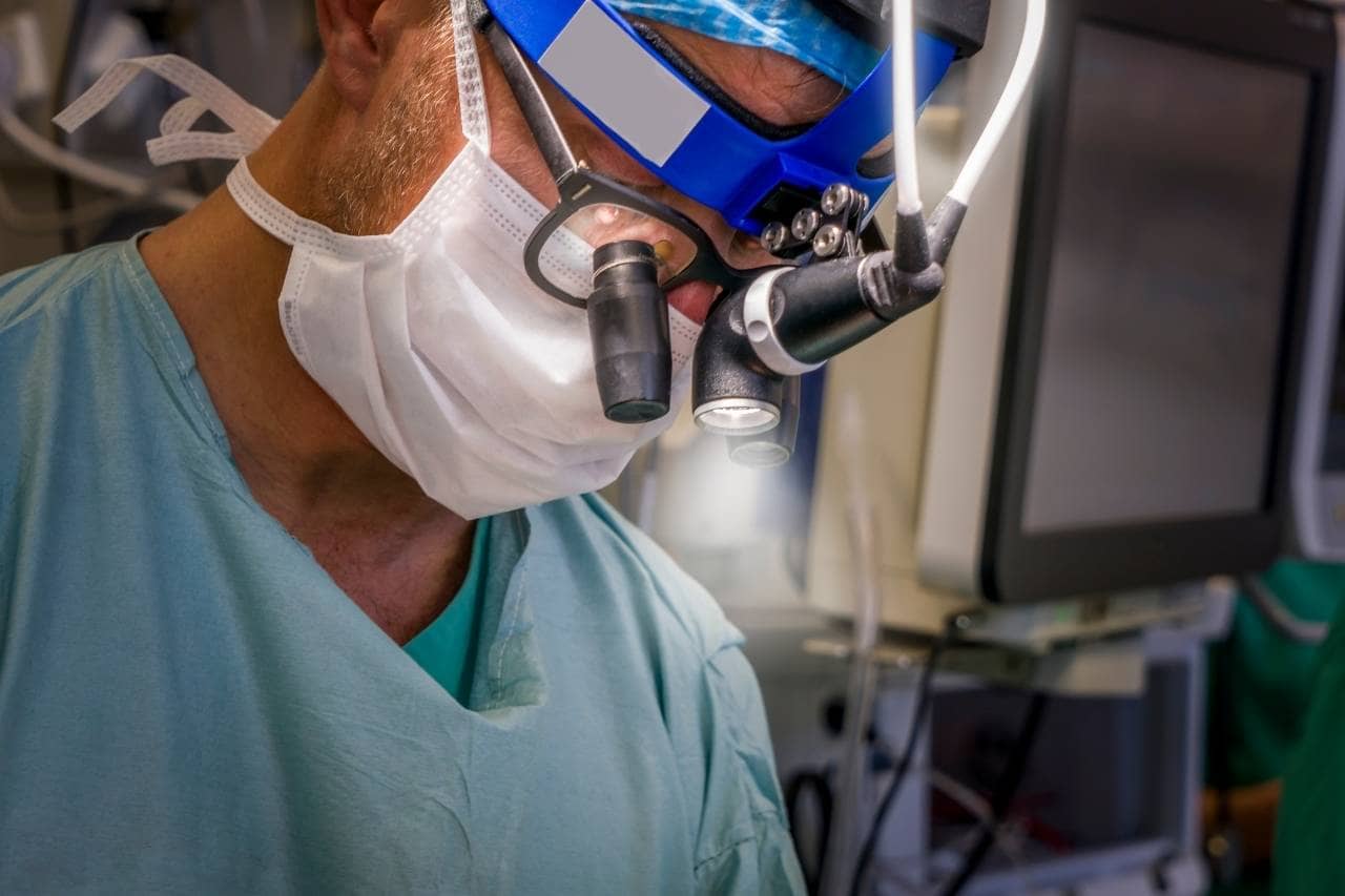 Neurosurgeon with mask and eyewear
