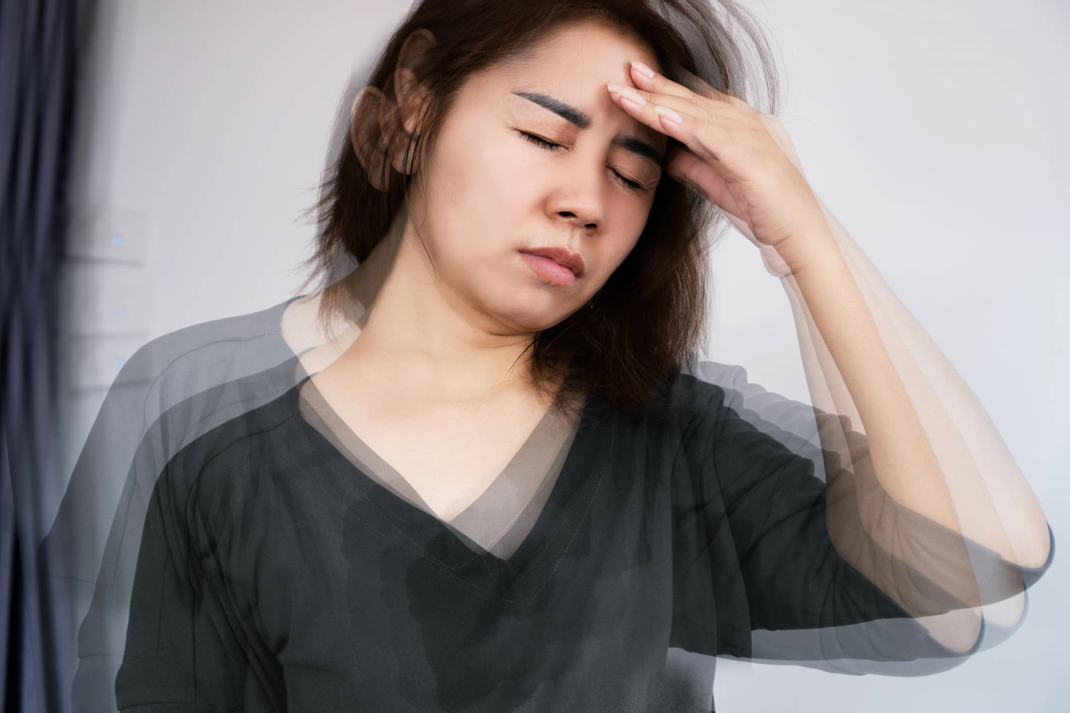 Woman Holding Her Head