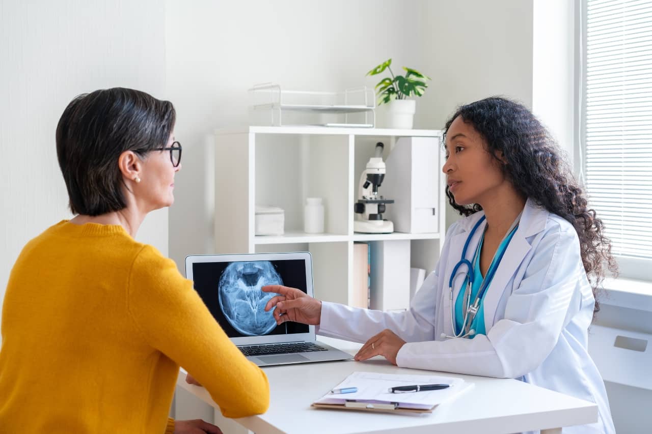 Woman patient and neurologist talking