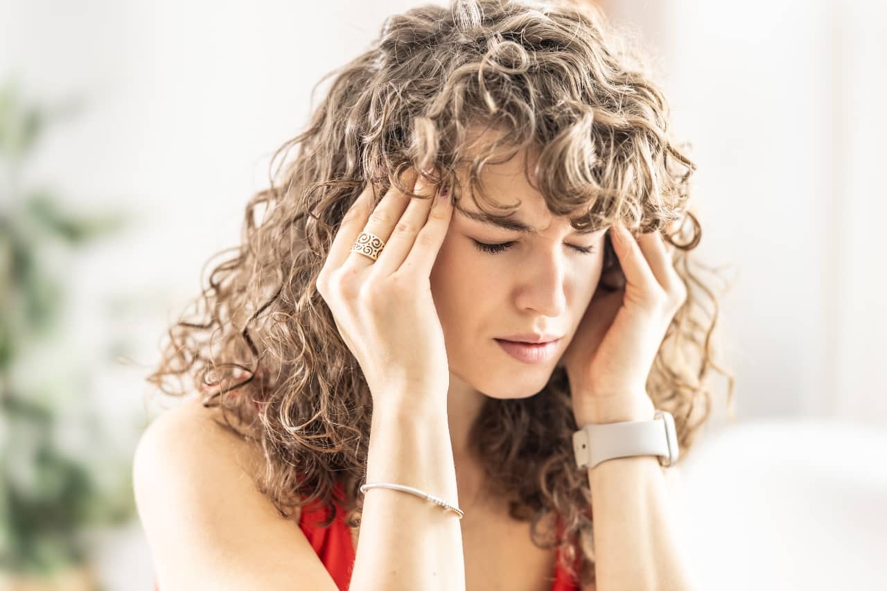 Young woman with a headache