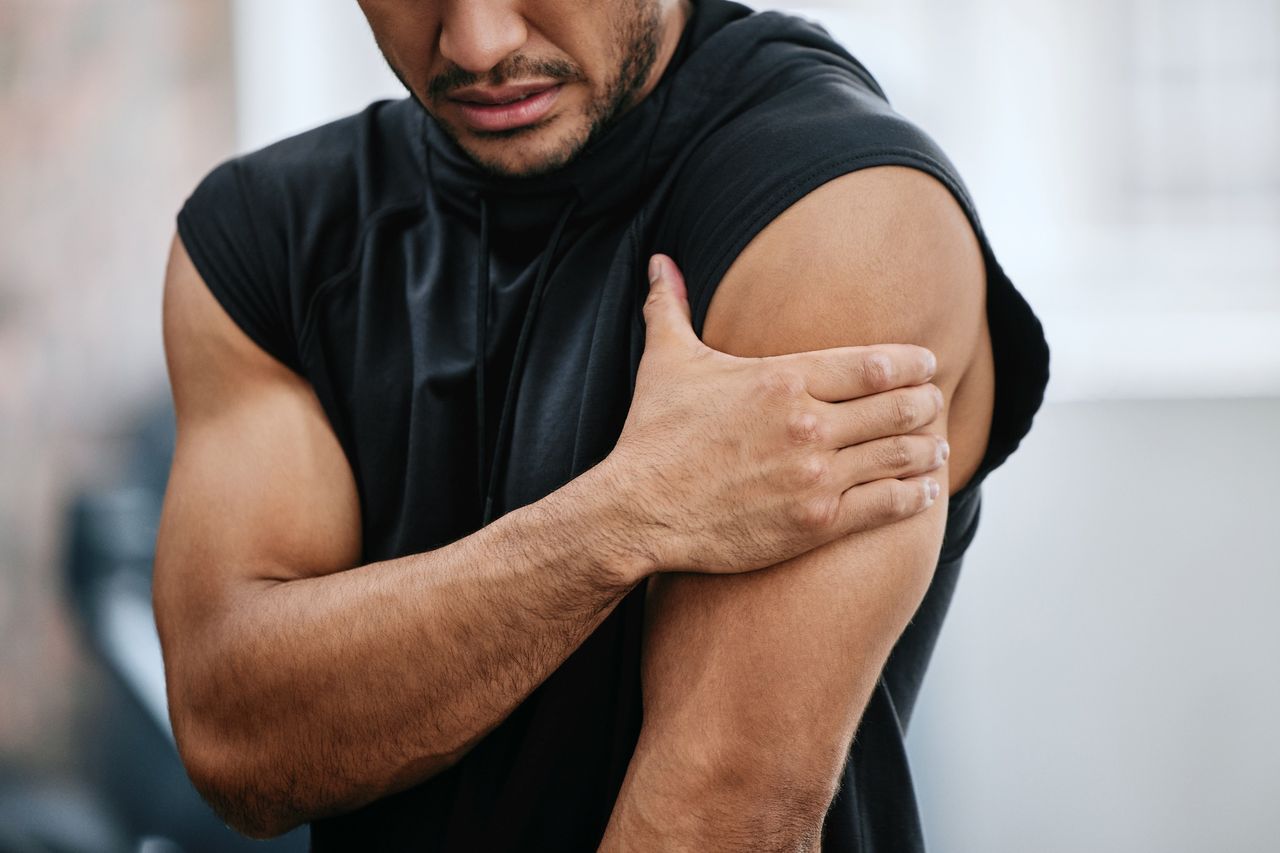 Man holds his shoulder