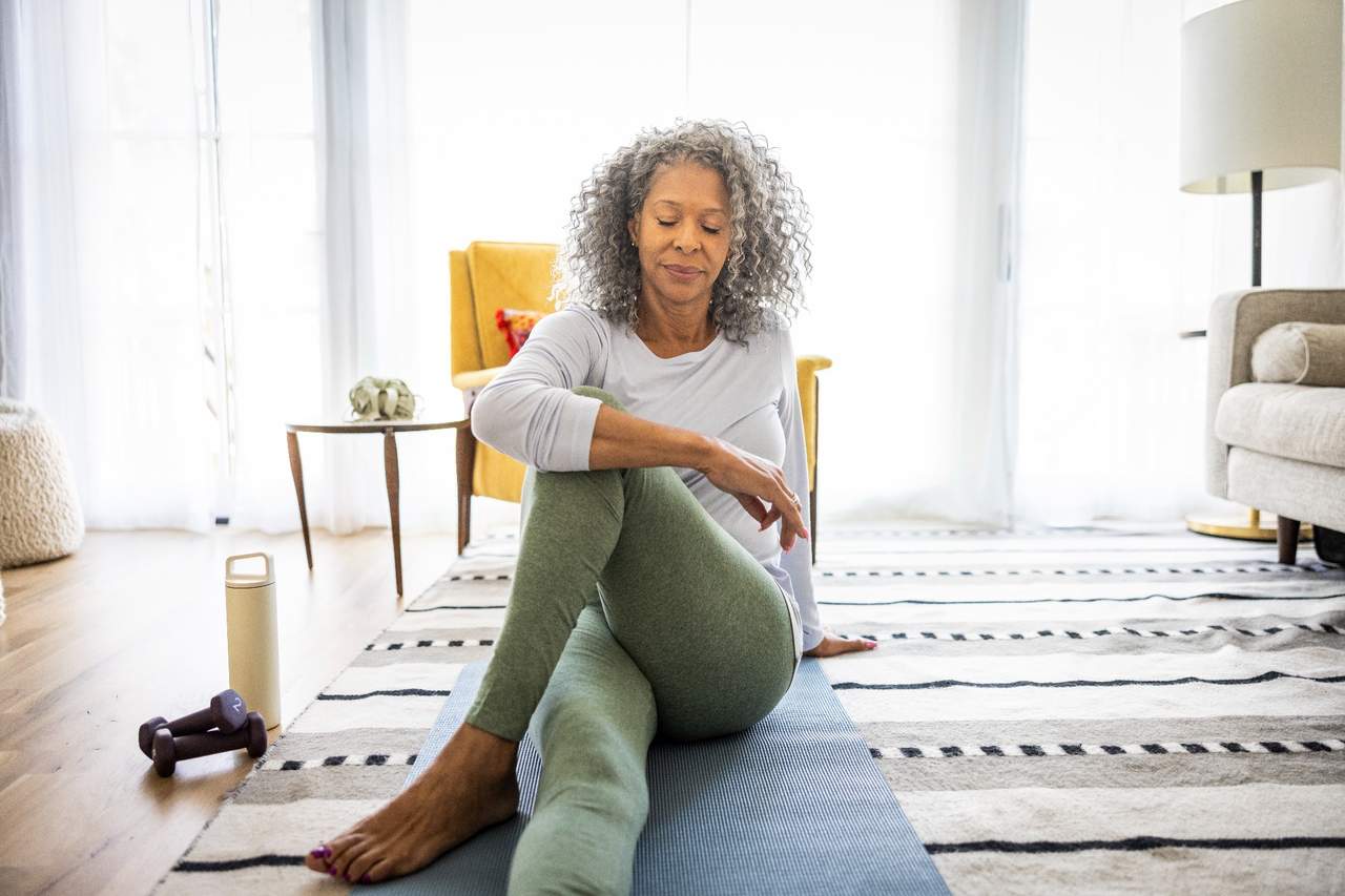 Woman stretching at home