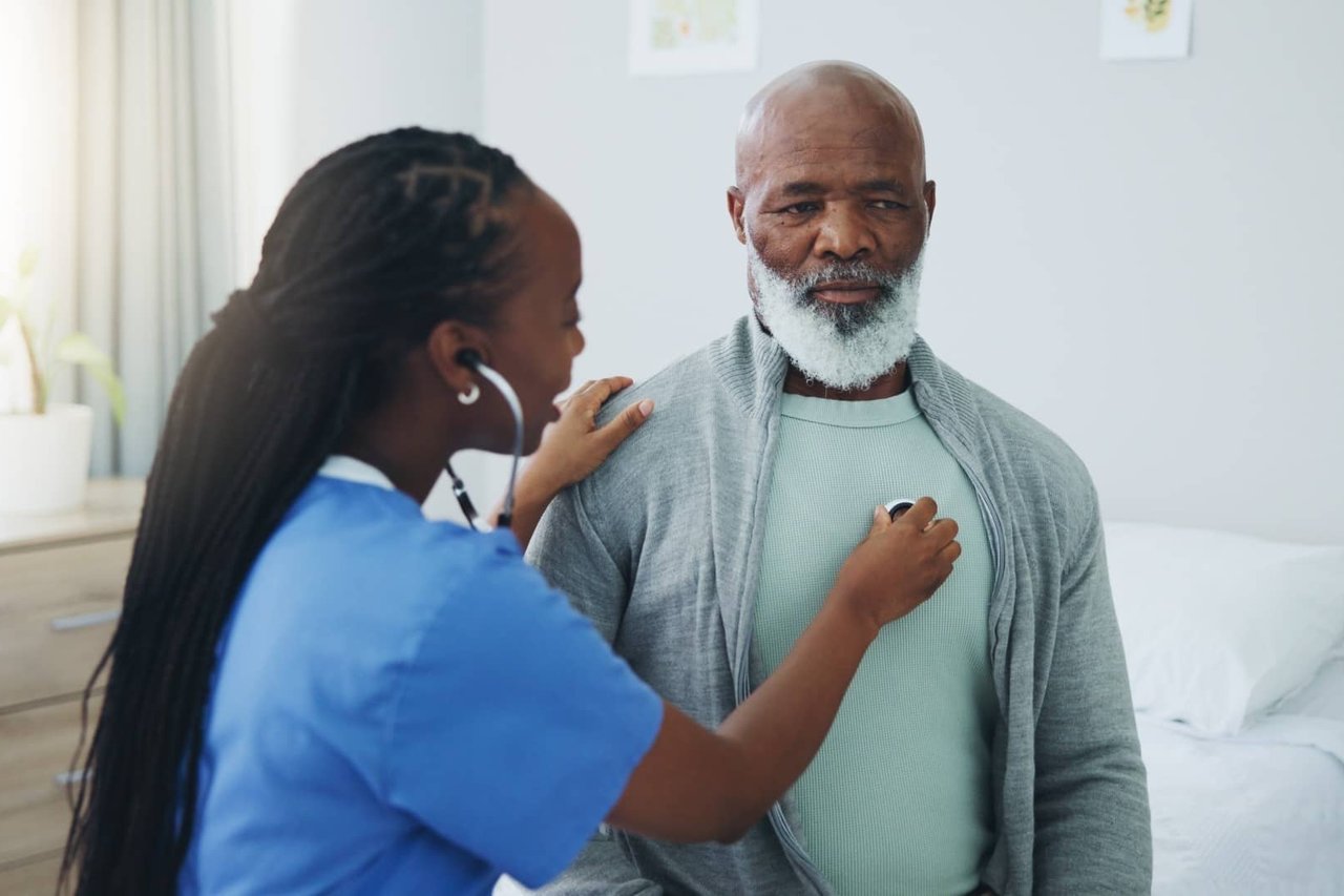 Nurse checking a man's lungs