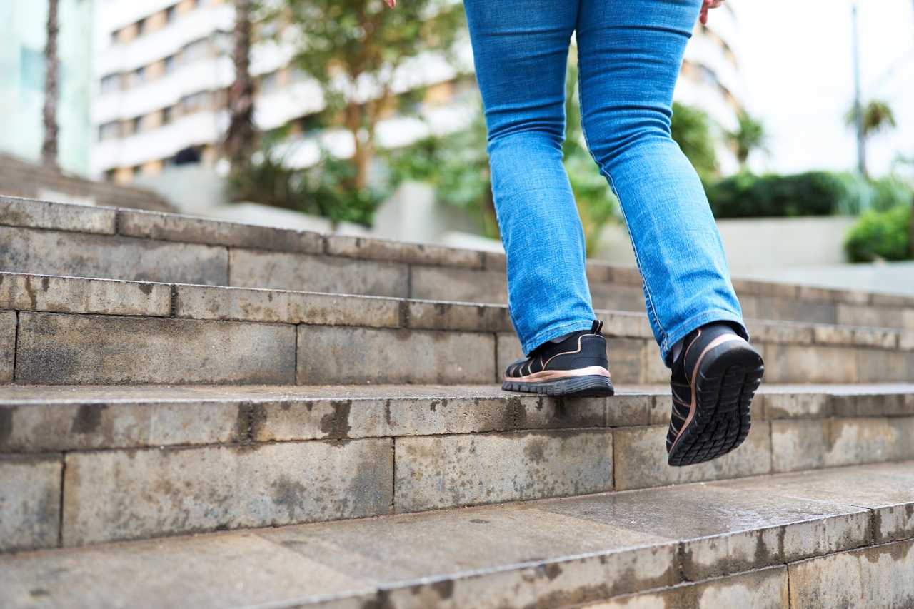 woman walking up stairs