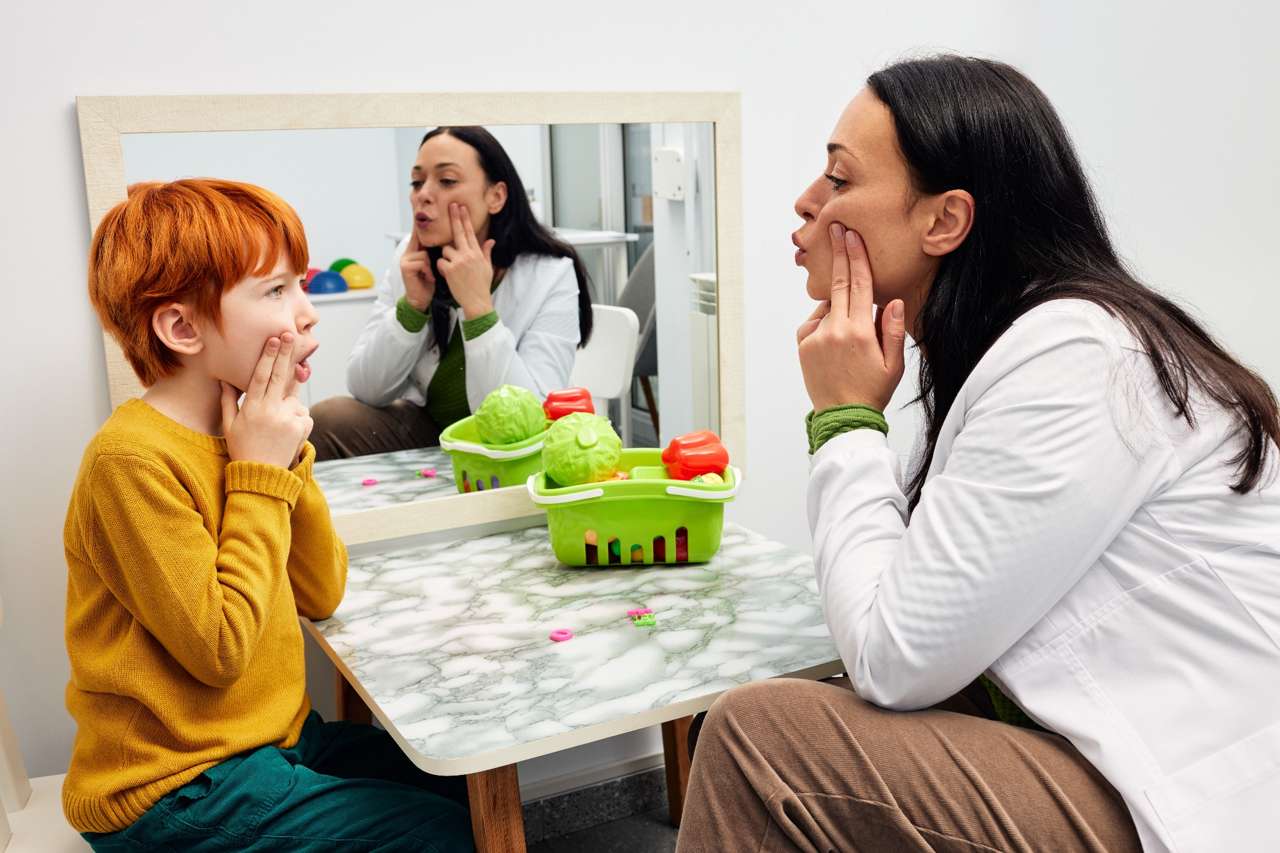 Speech pathologist working with a child