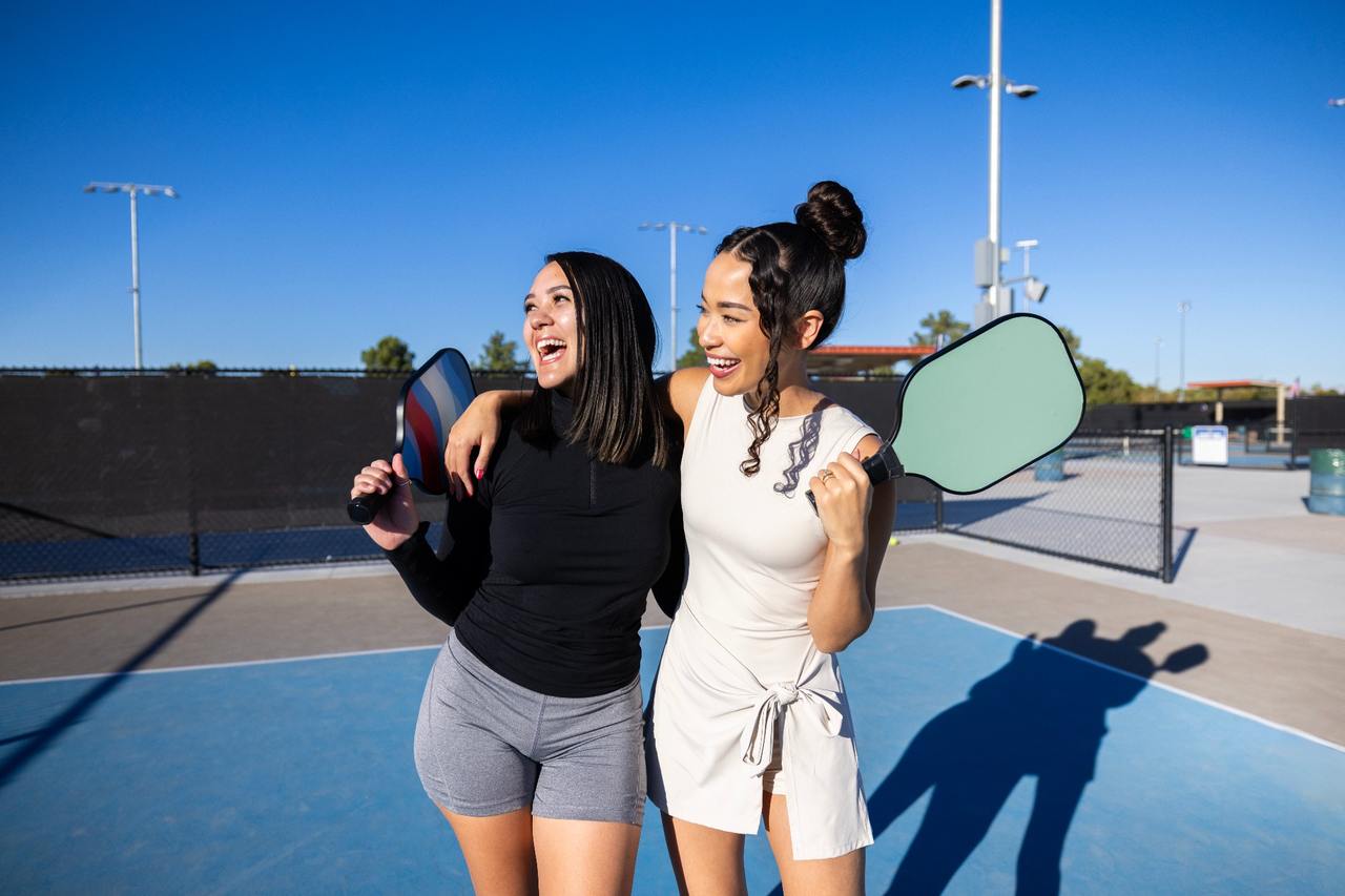 Two woman on pickleball court