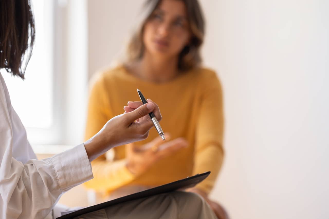 Woman listening to a doctor