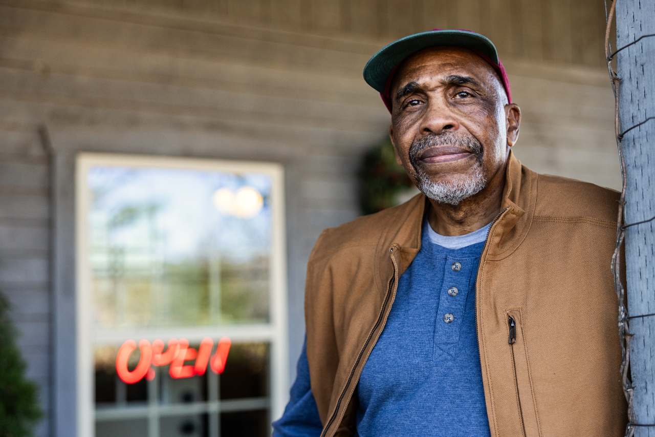 older man outside store