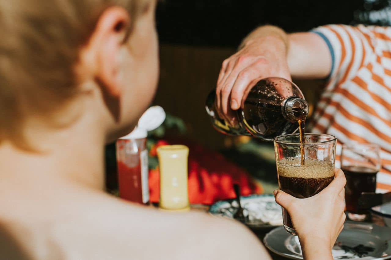 Person pouring a drink