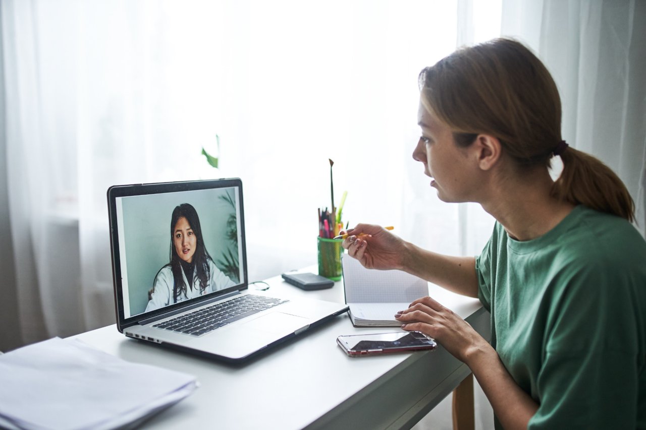 Woman on a video visit call with a doctor