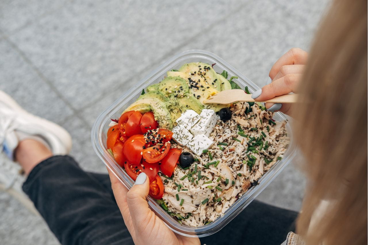 Woman eating high protein lunch
