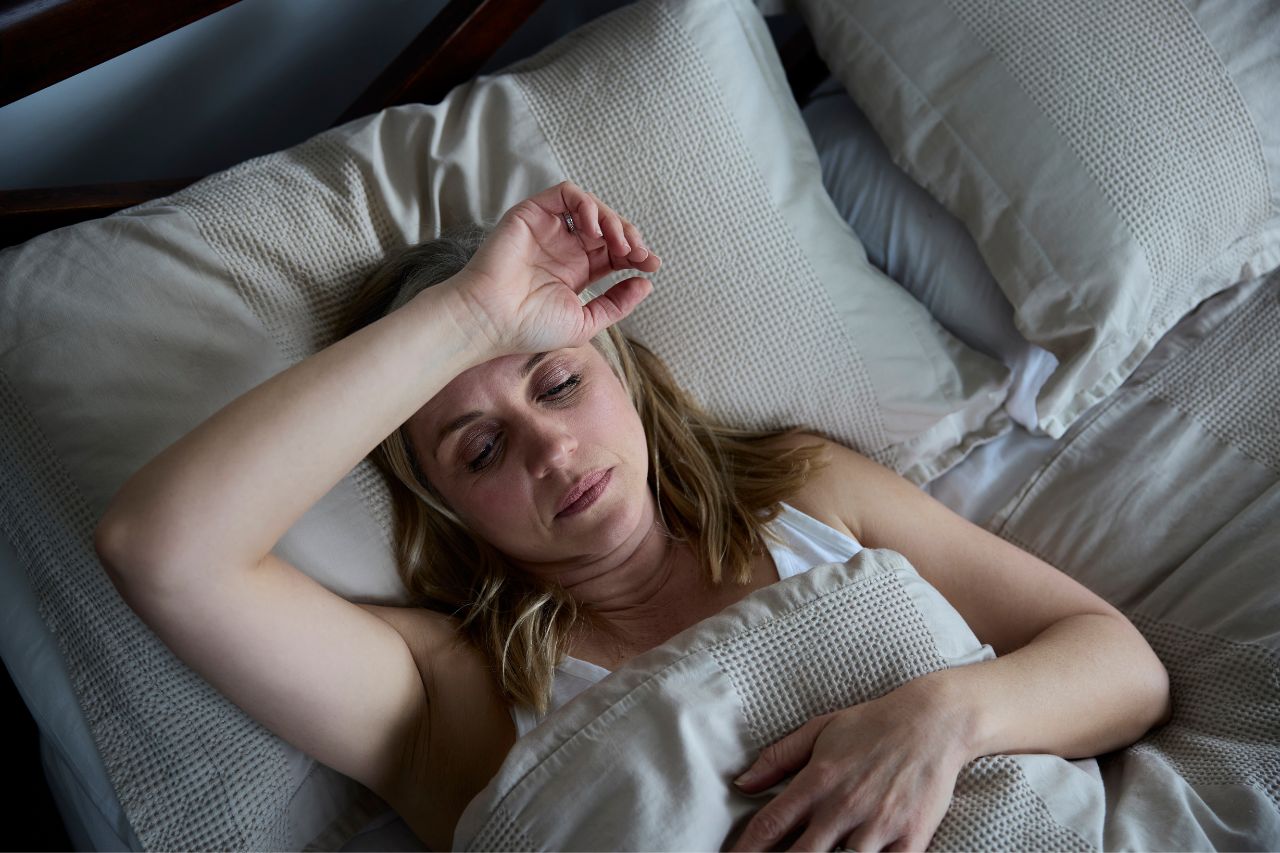 woman sweating in bed