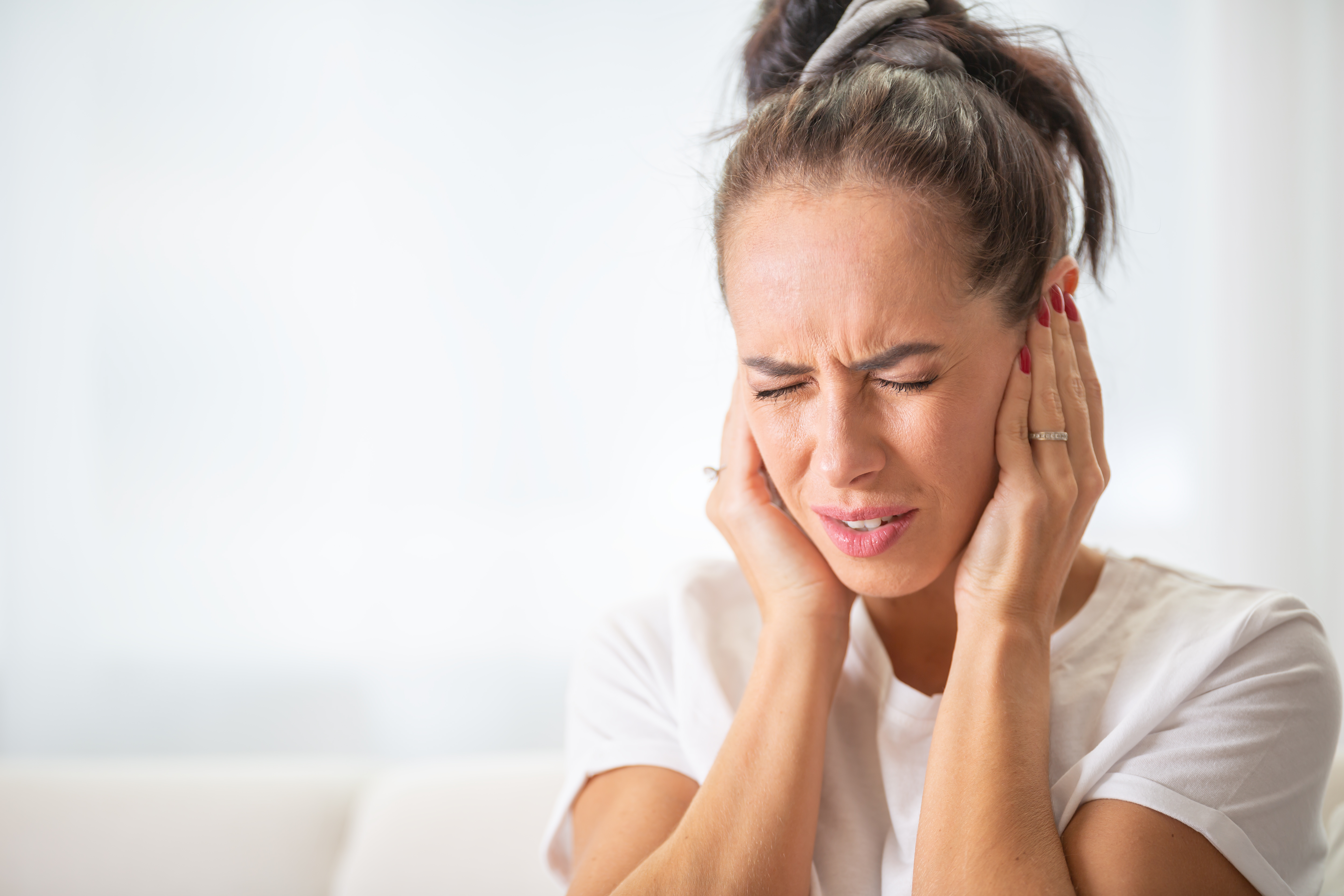 woman tired from tinnitus