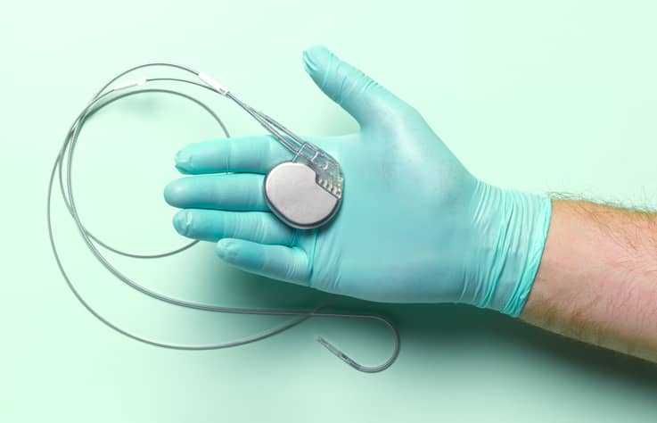Pacemaker Device in a Gloved Hand