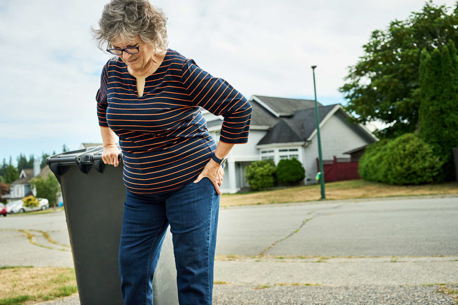 Woman holding hip