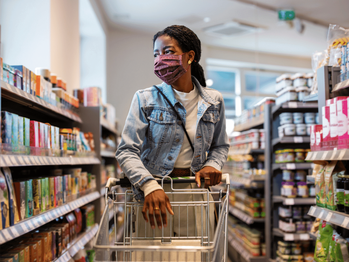Woman wearing a mask while grocery shopping