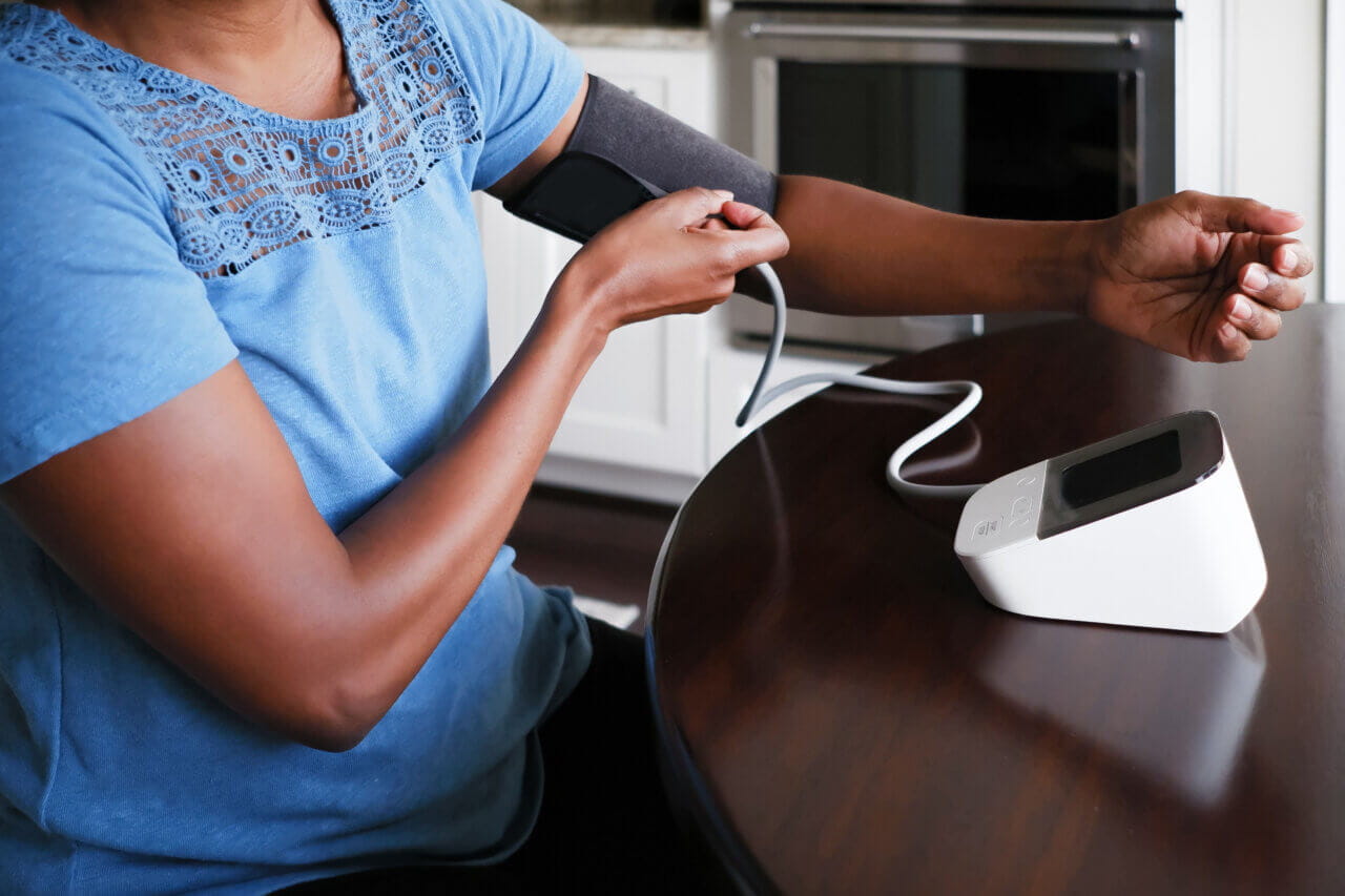 woman checking her blood pressure