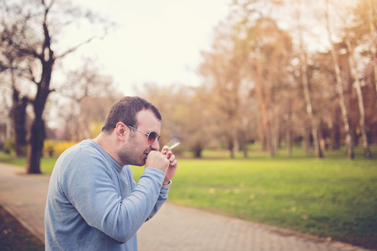 Person coughing while smoking