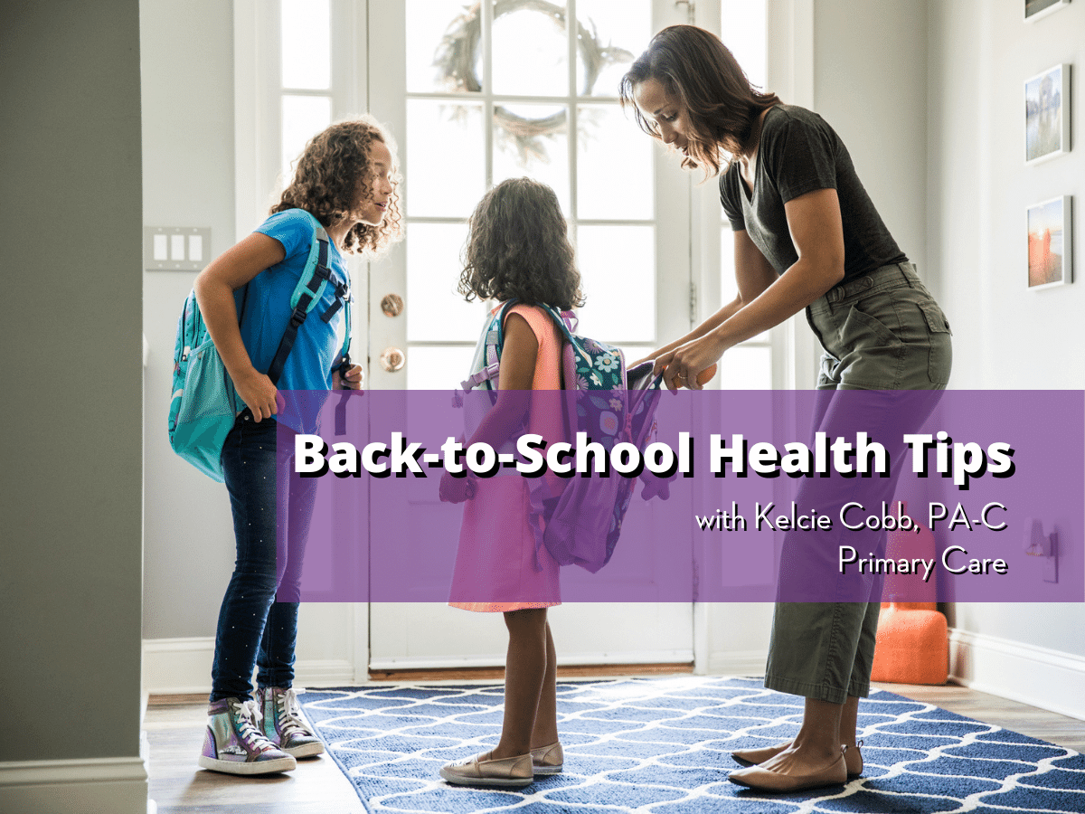 Mother helps two young children with their backpacks, text on image reads Back to School Health Tips with Kelcie Cobb, PA-C, Primary Care