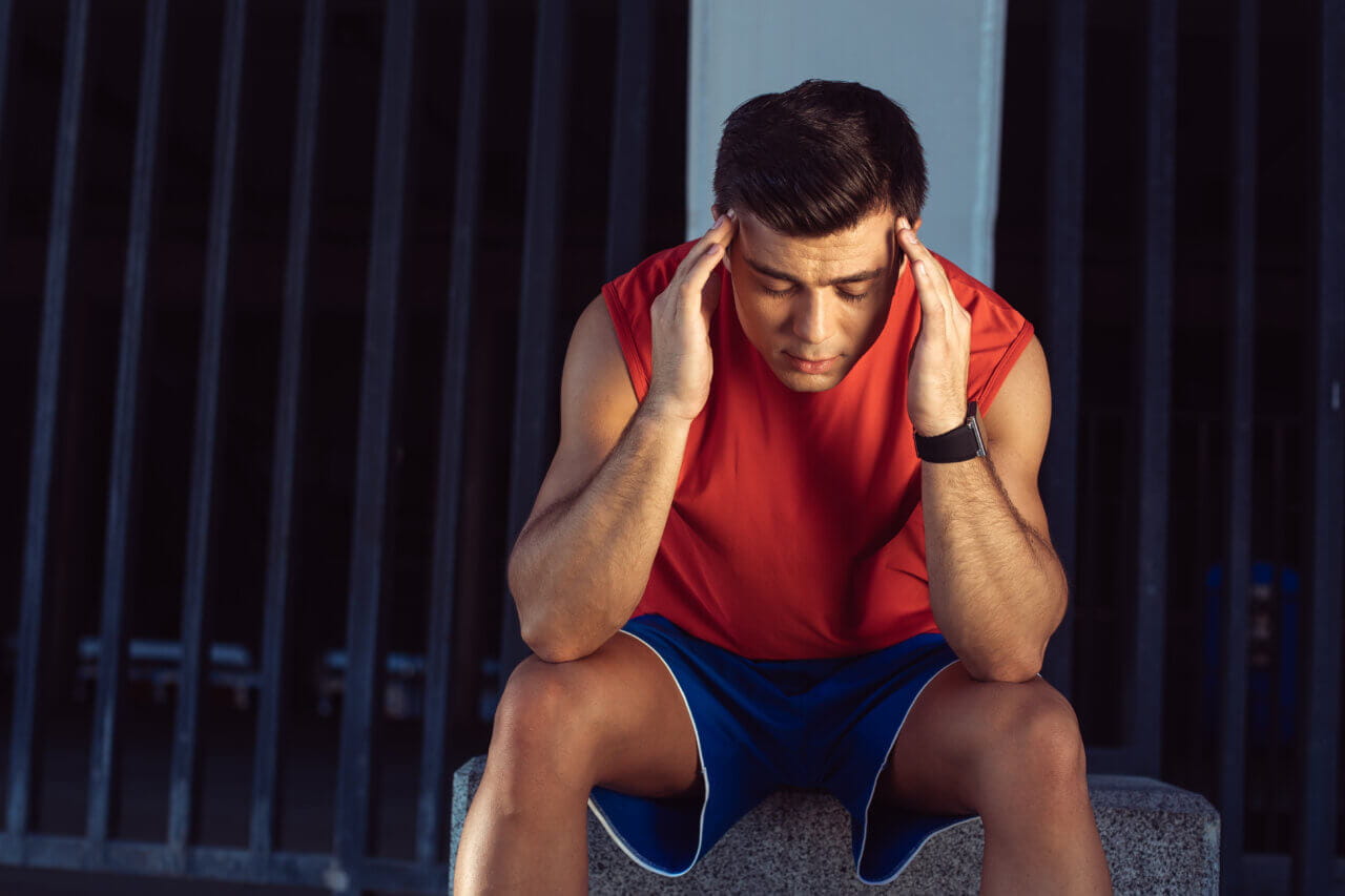 young man with a concussion headache