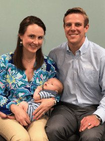 Couple holding newborn baby