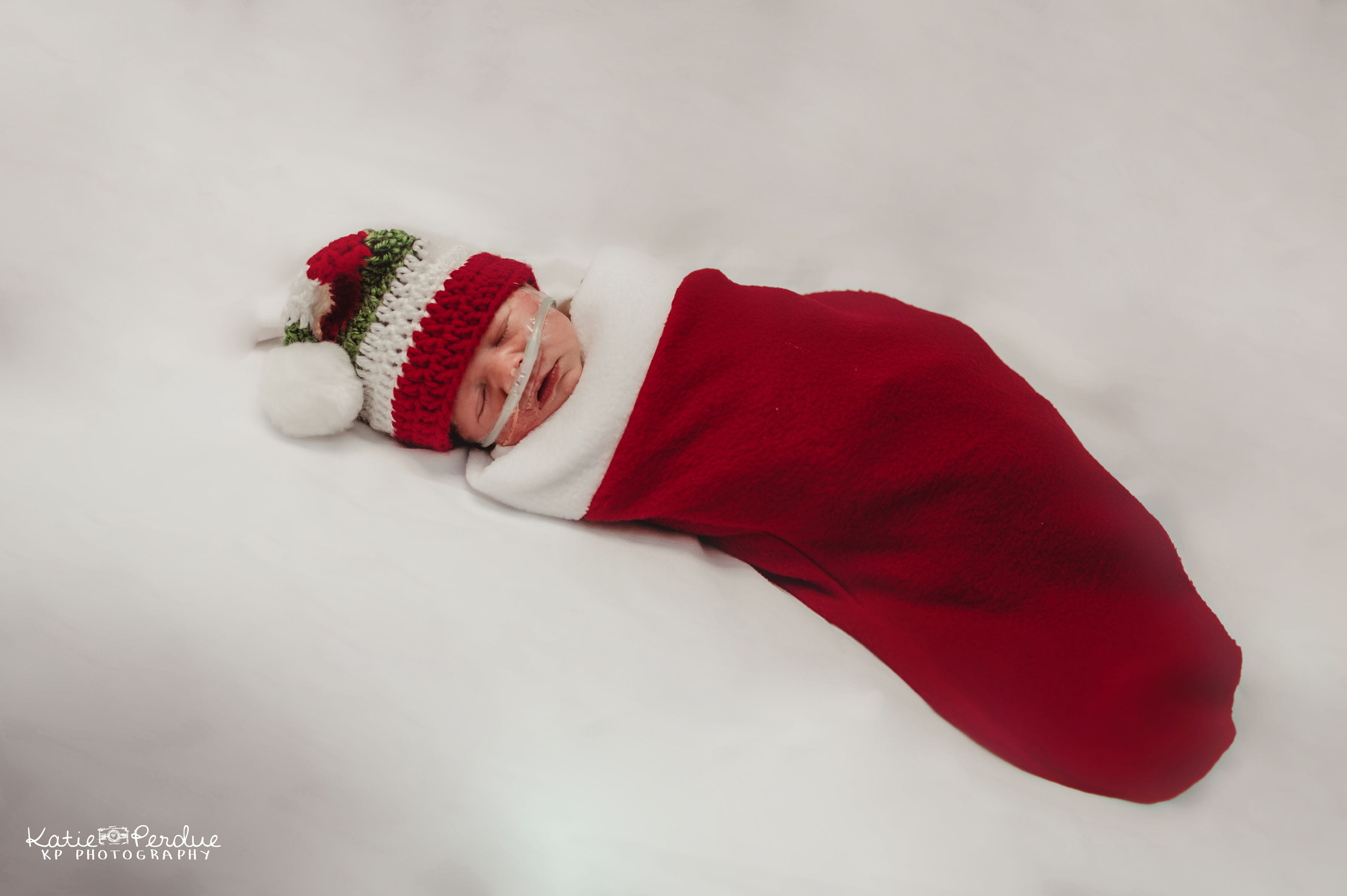 Newborn baby in Christmas stocking