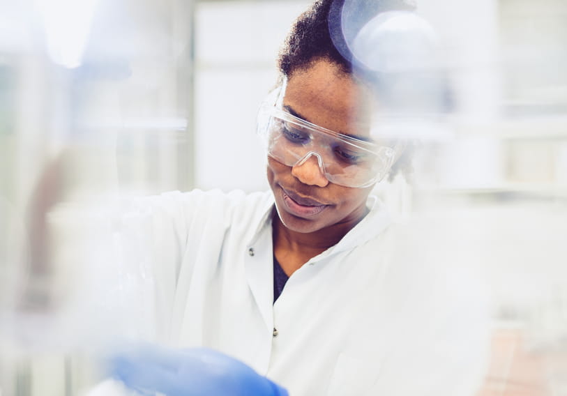 Scientist Using an Automatic Pipette